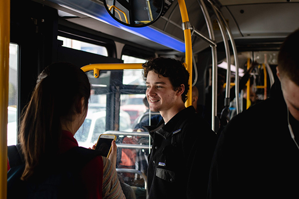 riders on a crowded bus