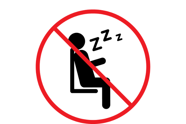 A black icon of a person sleeping on a chair with "Zzz" above, overlaid with a red prohibition circle and line.