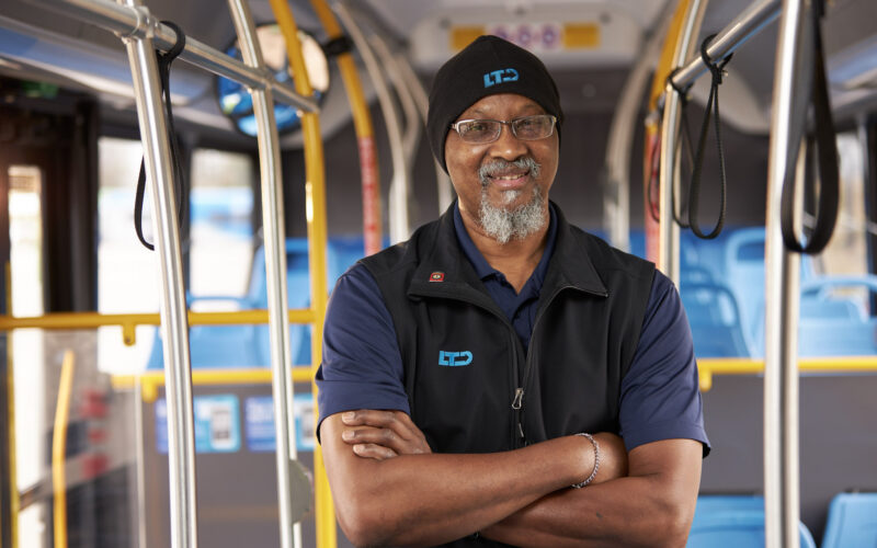 employee standing in bus