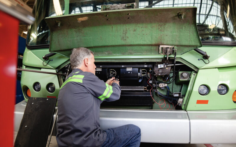 mechanic fixing engine